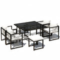 Vetra – Ensemble Table de Jardin 117 cm avec 4 Fauteuils & 2 Poufs – Blanc & Noir